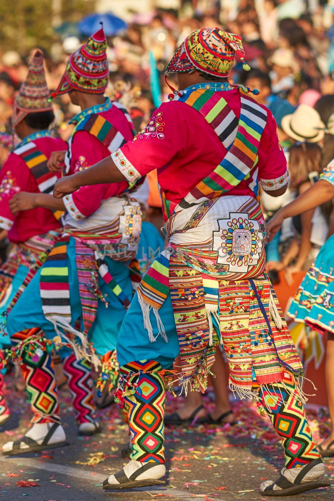 Arica, Chile - January 23, 2016: Tinkus dancing group in colourful costumes performing a traditional ritual dance as part of the Carnaval Andino con la Fuerza del Sol in Arica, Chile.