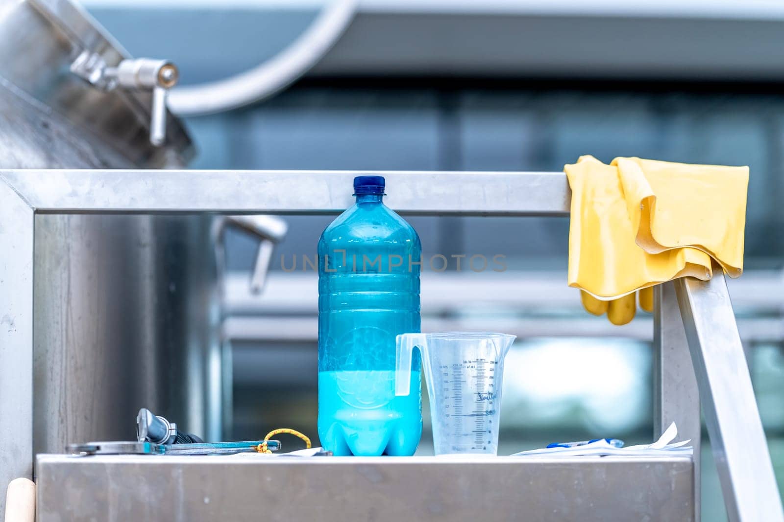 chemicals and gloves for cleaning stainless steel surfaces. High quality photo