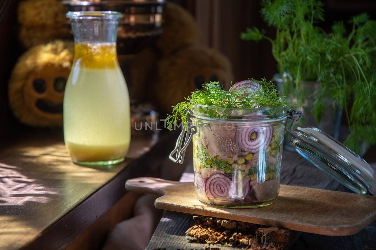 appetizer of herring with onions marinated in mustard-vinegar sauce with dill and green peas, recipe. High quality photo