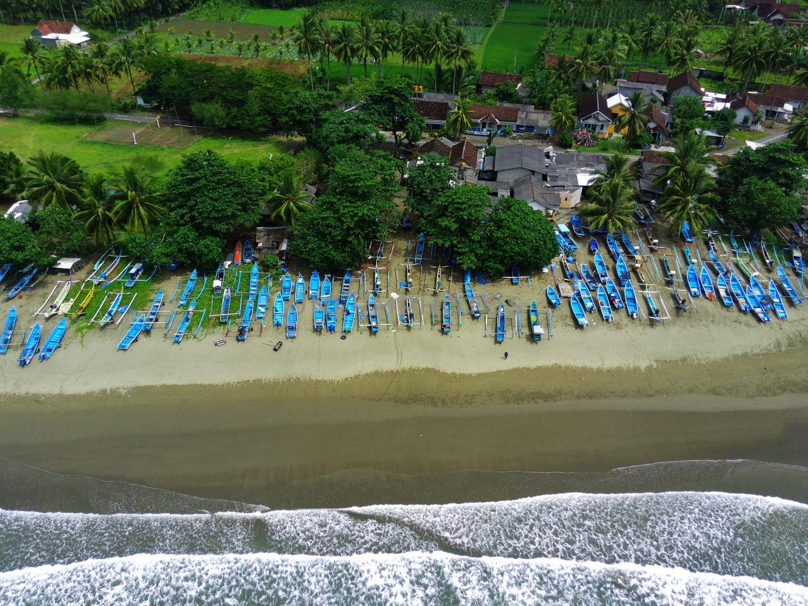 Aerial view of boats moored off Rajegwesi Beach. Banyuwangi. Indonesia. Photo taken with drone.