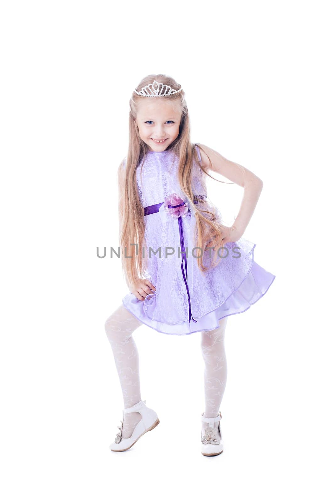Full length portrait of beautiful little girl in purple dress. Isolated on white