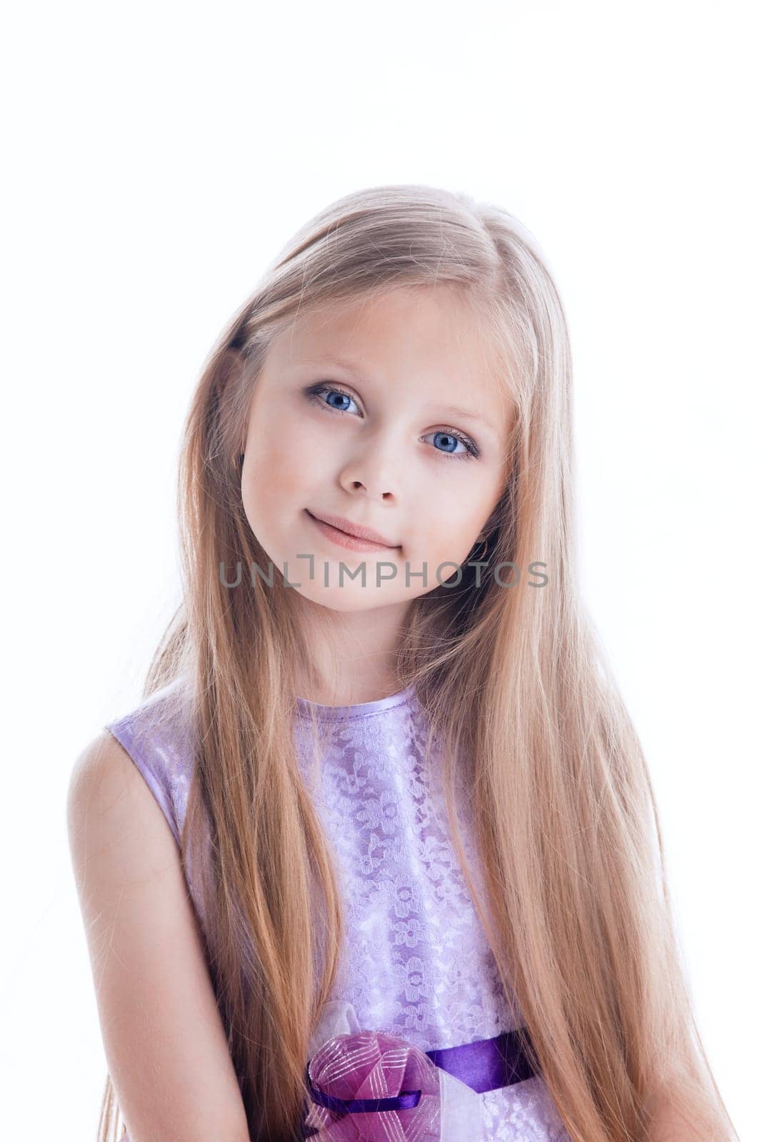 Portrait of beautiful blonde little girl in purple dress with long hairs Isolated