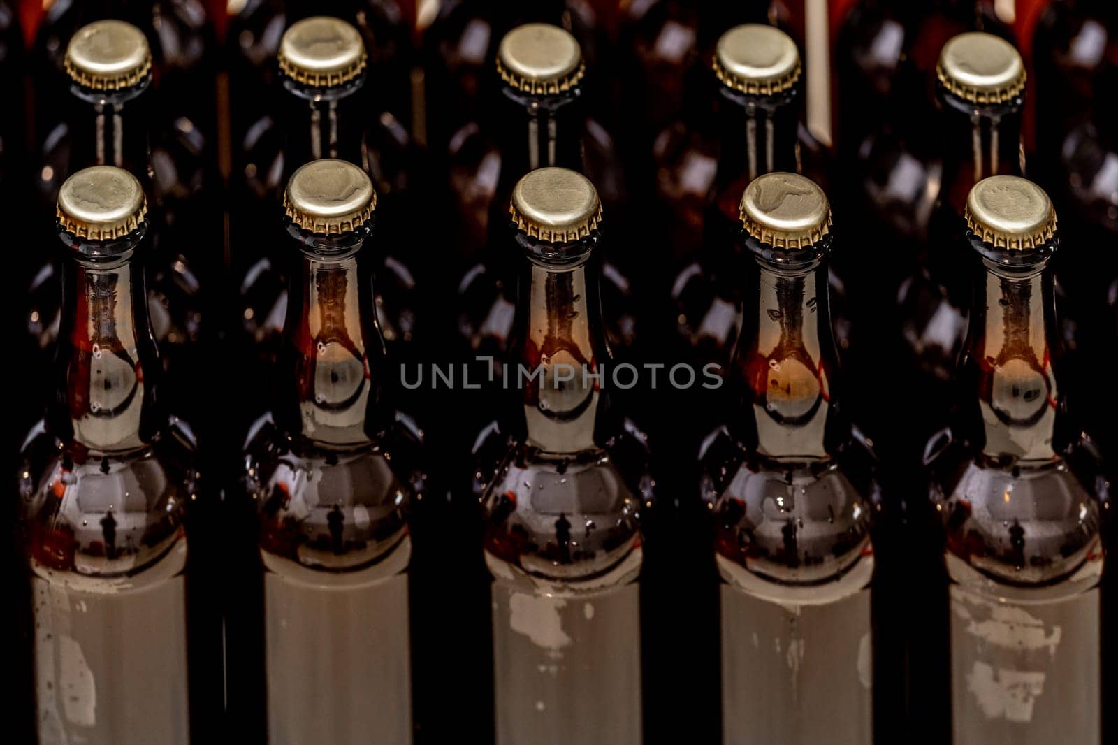 glass bottles with beer in the warehouse of the brewery. High quality photo