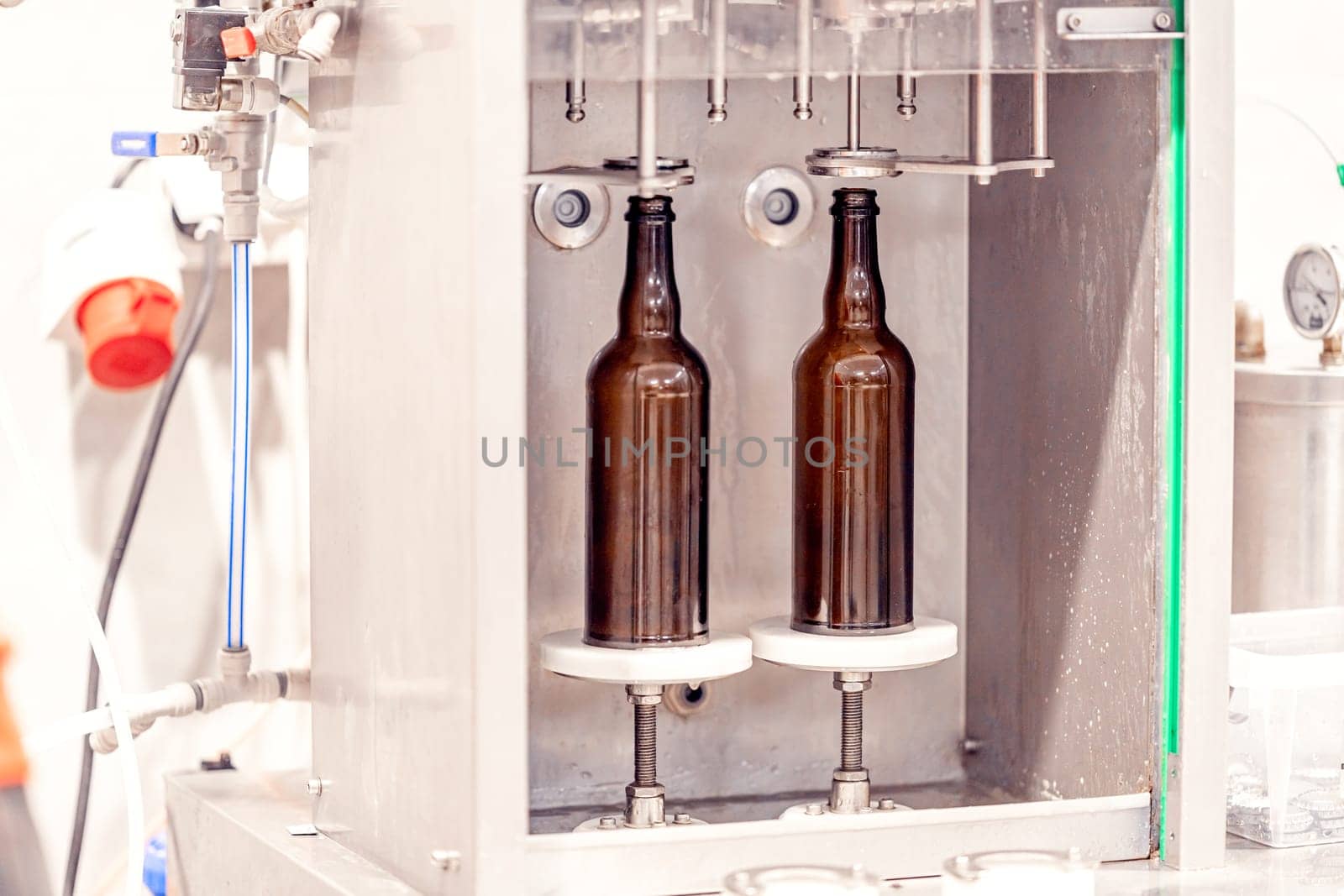 machine for automatic filling of beer bottles in a brewery. High quality photo