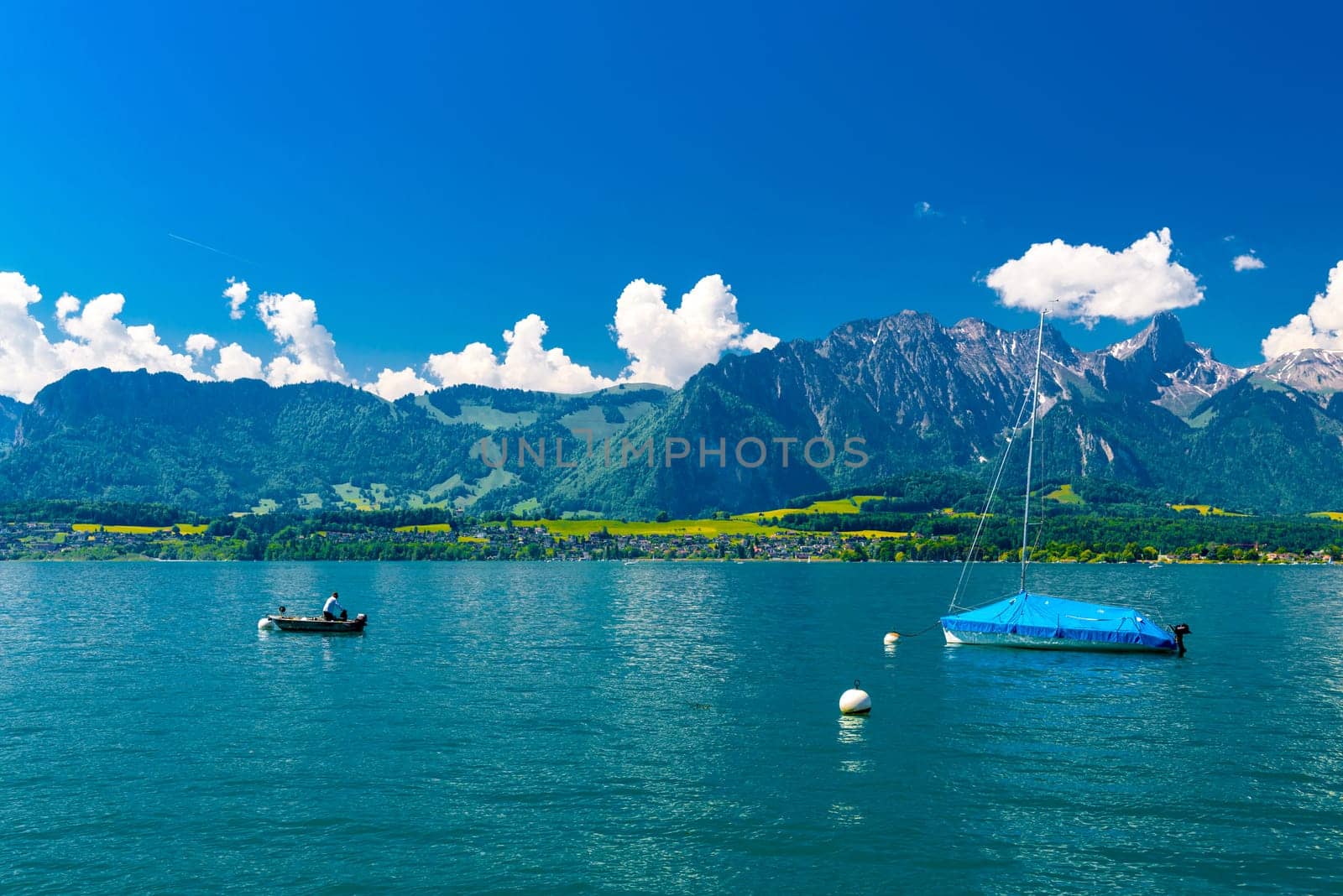 Boats and mountains on the Lake Thun, Thunersee Bern Switzerland by Eagle2308