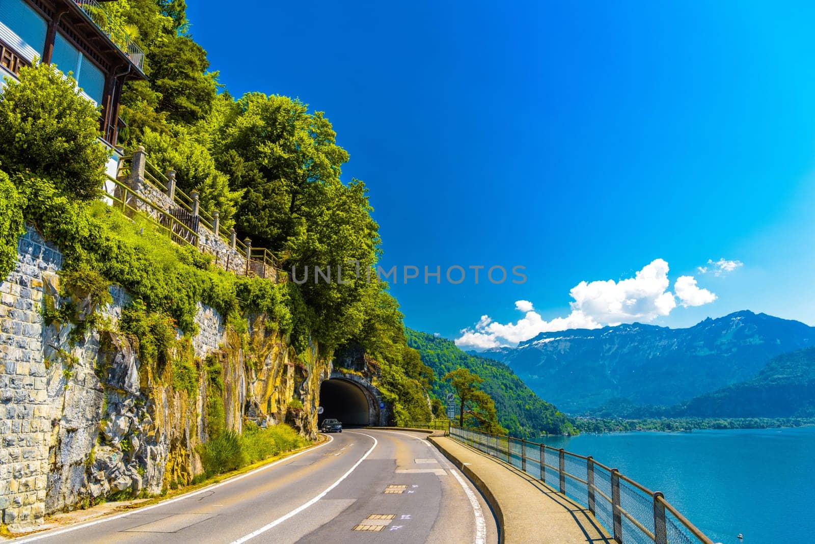 Lake Thun, road and tunnel near mountains, Thunersee Bern Switzerland by Eagle2308