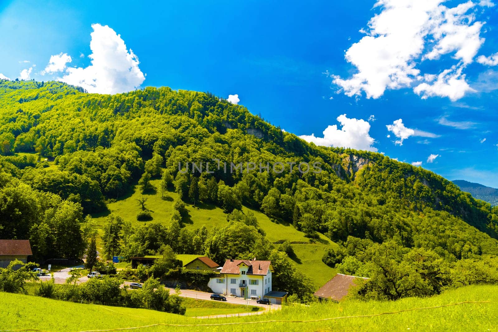 Houses and mountains near Lake Lungern, Lungerersee, Obwalden Switzerland.