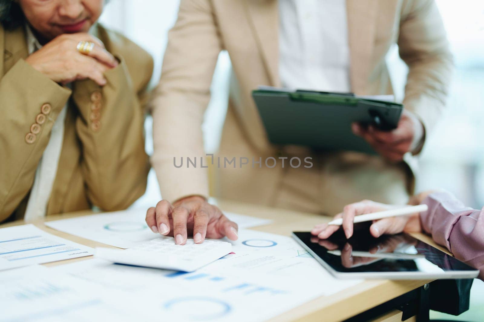 Asian entrepreneurs and business people meeting in a conference room in business planning, financial budget and investment risk assessment to analyze customer groups to increase company growth.