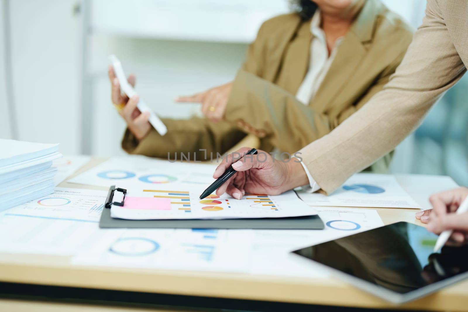 Asian entrepreneurs and business people meeting in a conference room in business planning, financial budget and investment risk assessment to analyze customer groups to increase company growth.