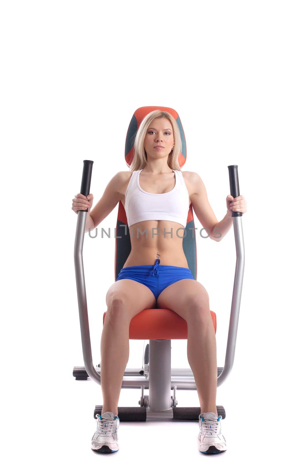 athletic blonde on modern gym equipment, isolated on white