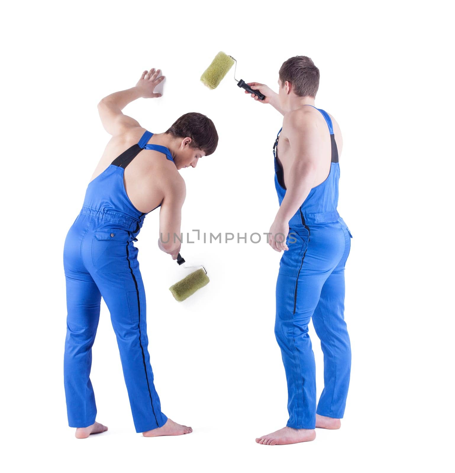 Rear view of sexy painters in blue overalls. Isolated on white