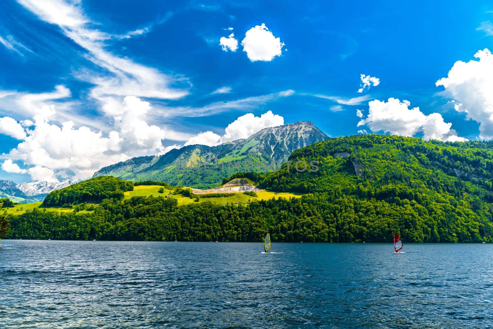 Windsurfers in the lake with mountains, Alpnachstadt, Alpnach Obwalden Switzerland by Eagle2308