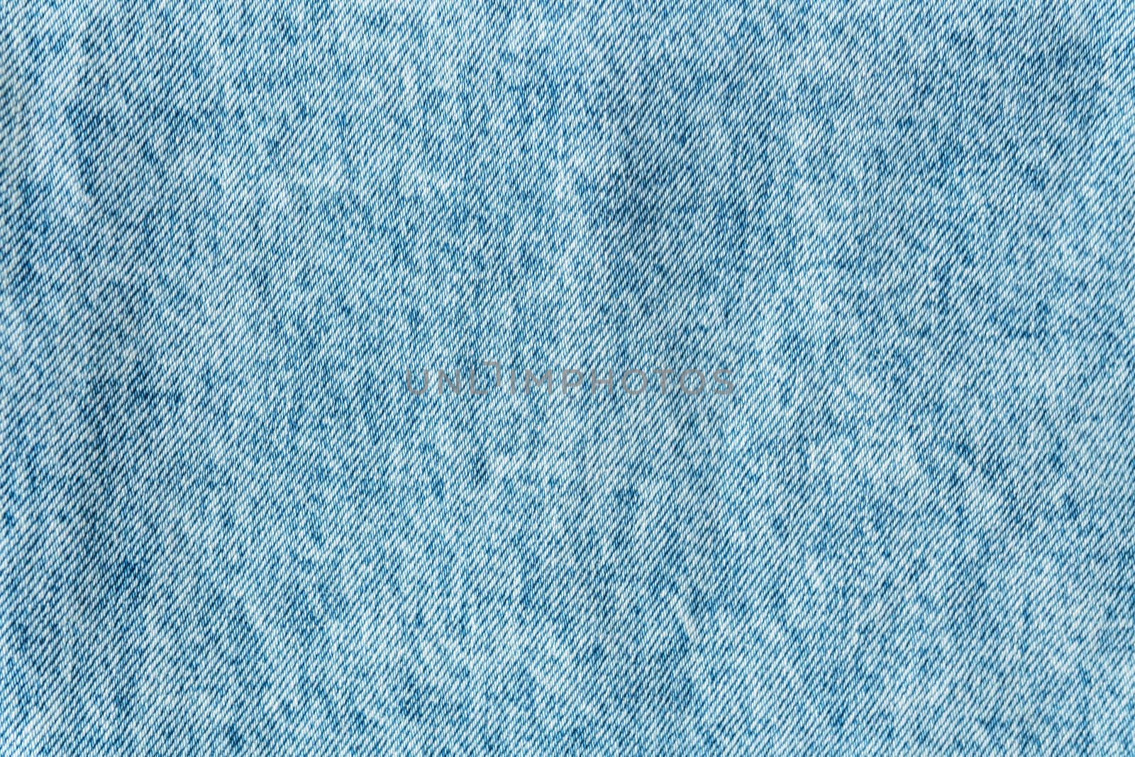 Denim structure, classic blue denim fabric, clear fabric structure, place for text. Background, texture. Selective focus, noise