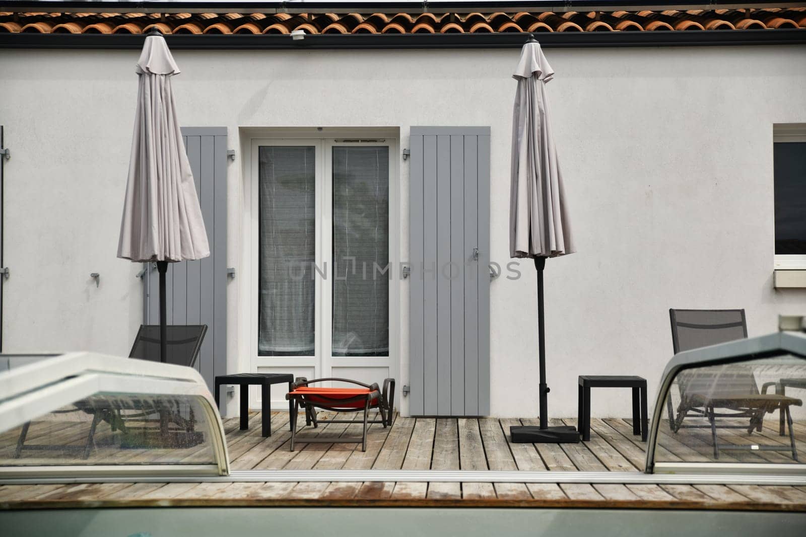 The sun loungers by the pool in the garden