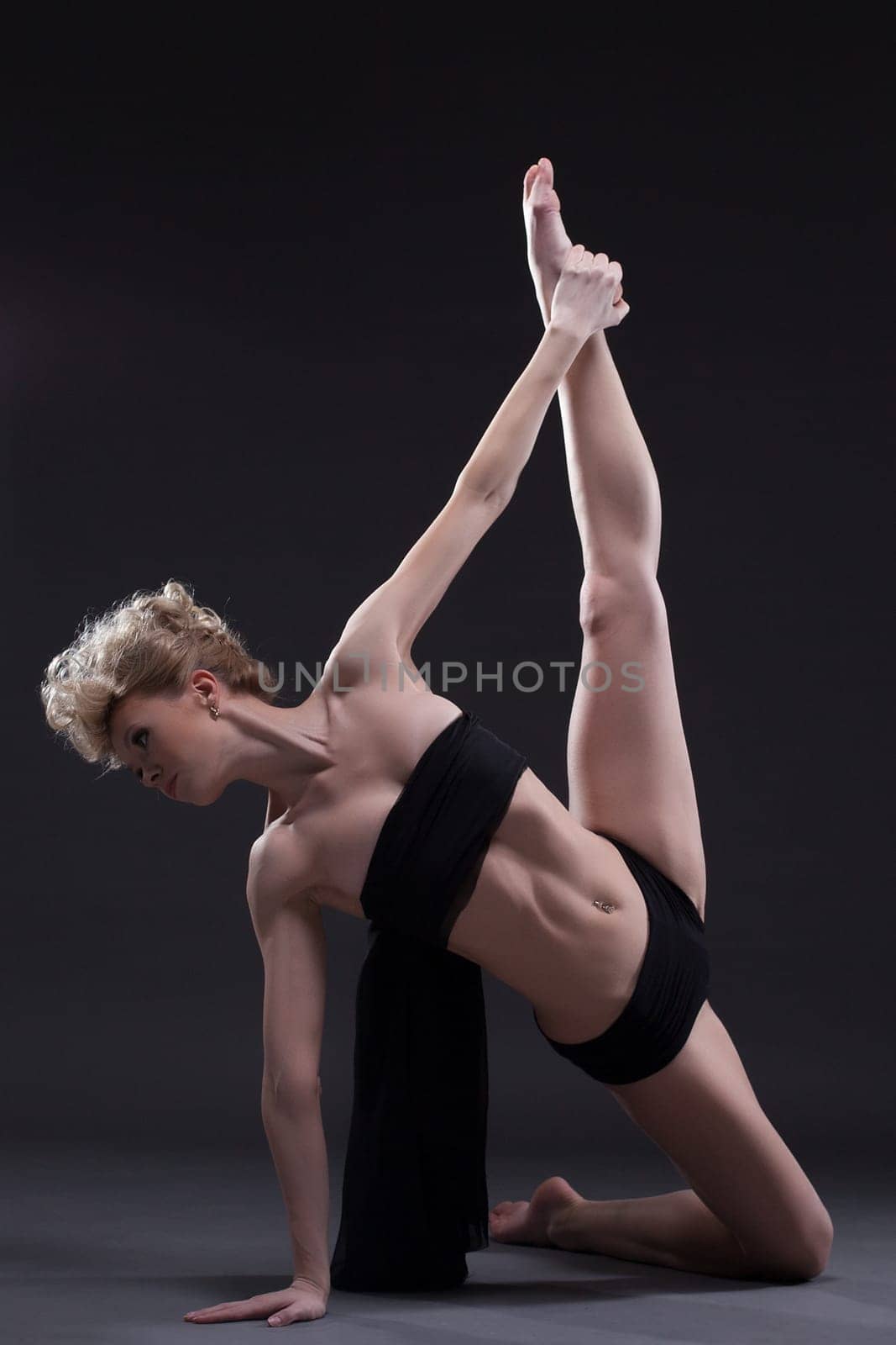 Full length portrait of slim dancer in black underwear