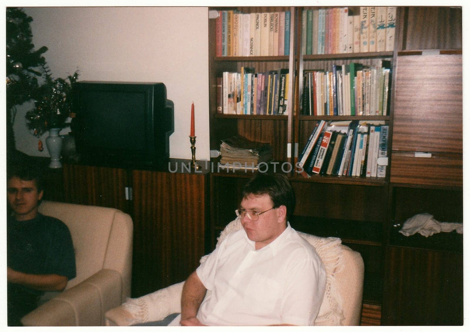 THE CZECHOSLOVAK REPUBLIC - CIRCA 1990s: Retro photo shows man at the home party.