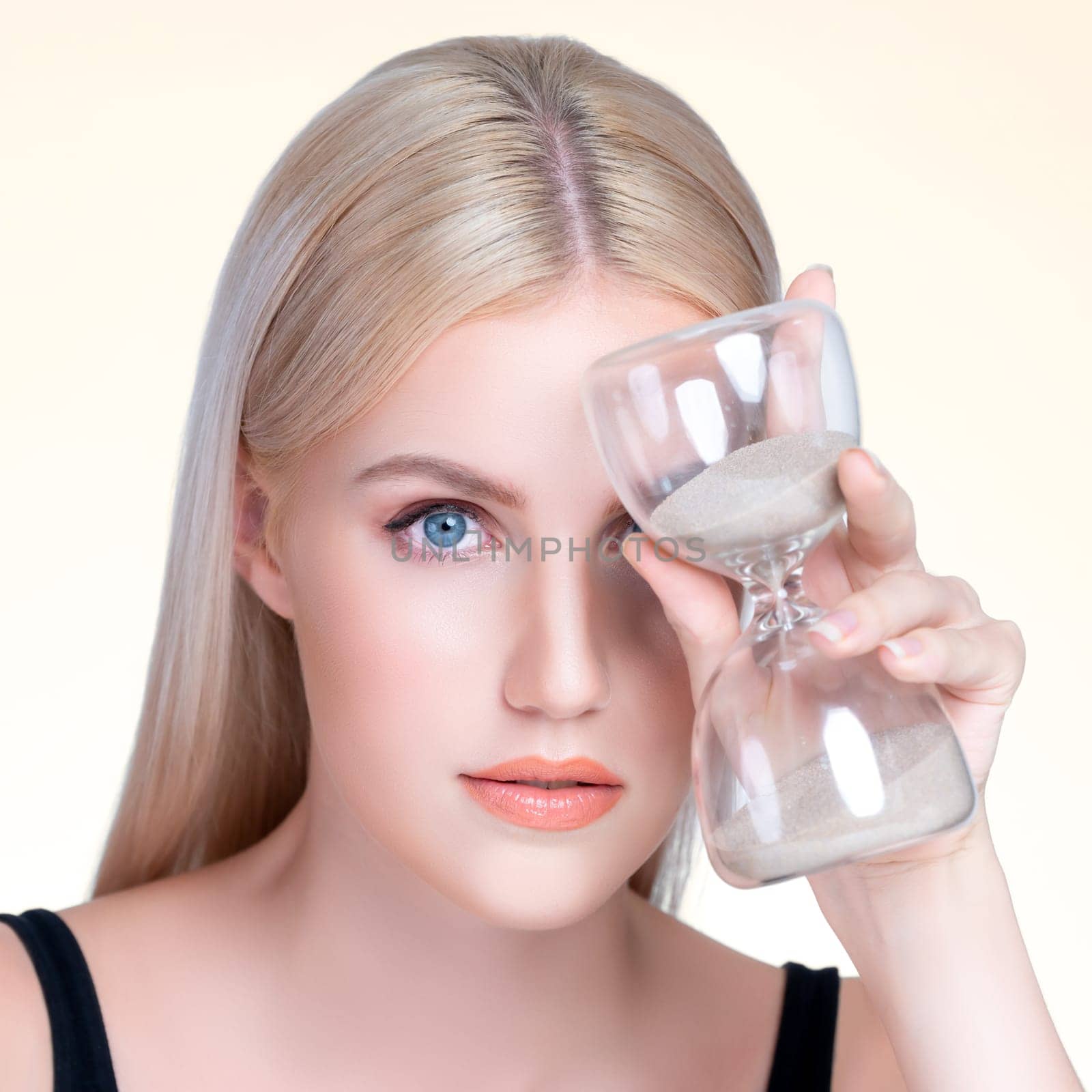 Personable beautiful woman with hourglass anti-aging as skincare concept by biancoblue