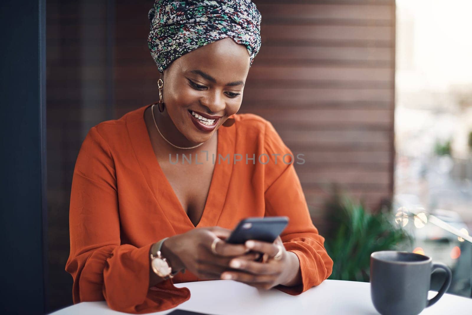 Open lines of communication are important. an attractive businesswoman sending a text while working in her office