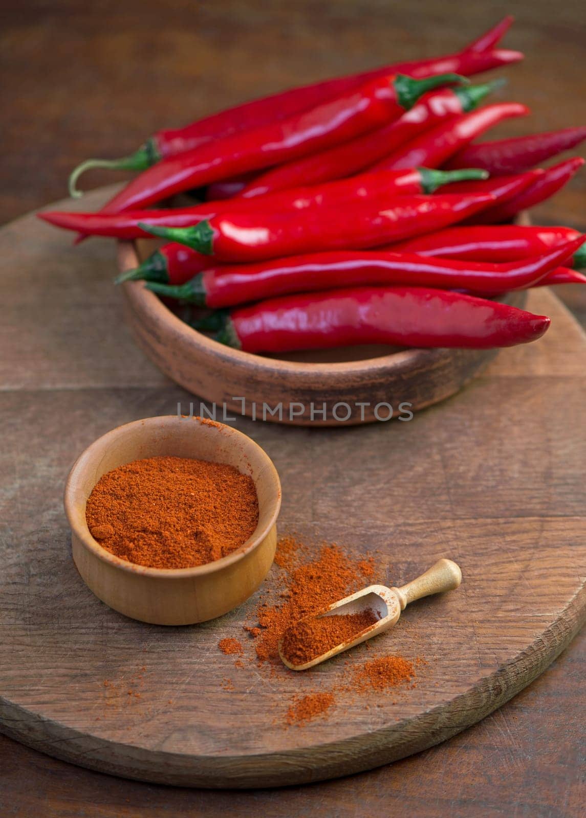 spicy food. Top view red dried crushed hot chili and raw chili in wooden bowl on rustic background, healthy spice by aprilphoto