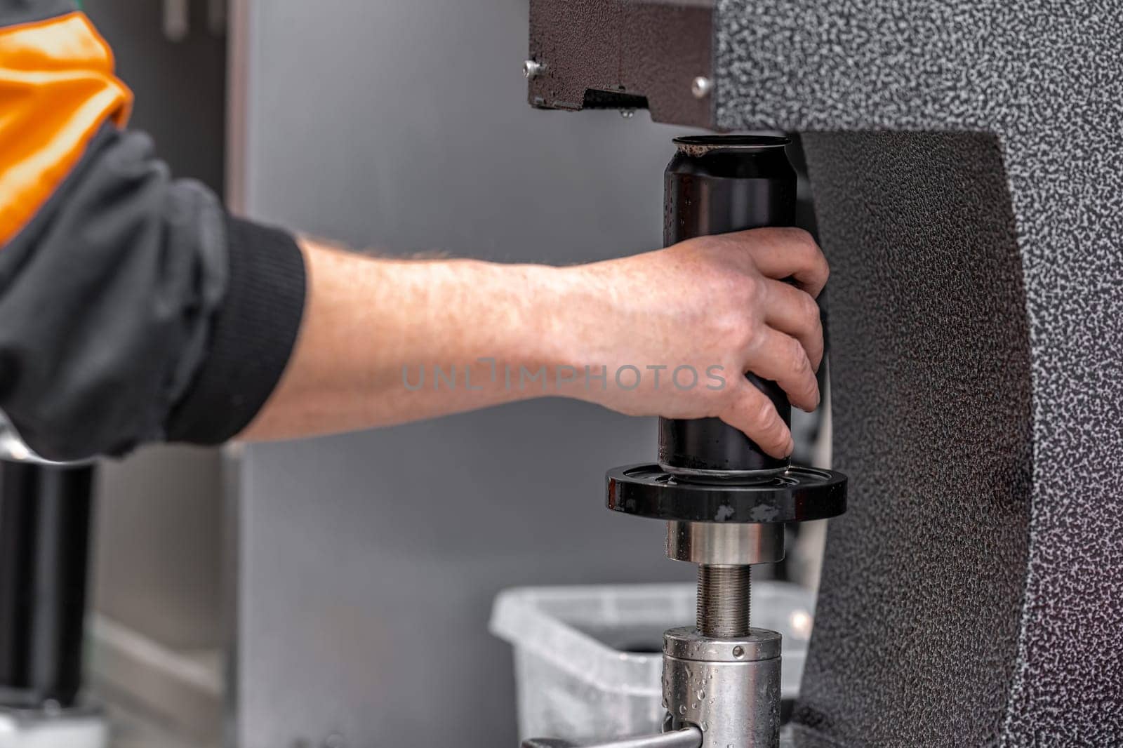 automatic filling and sealing of drink cans in the factory.