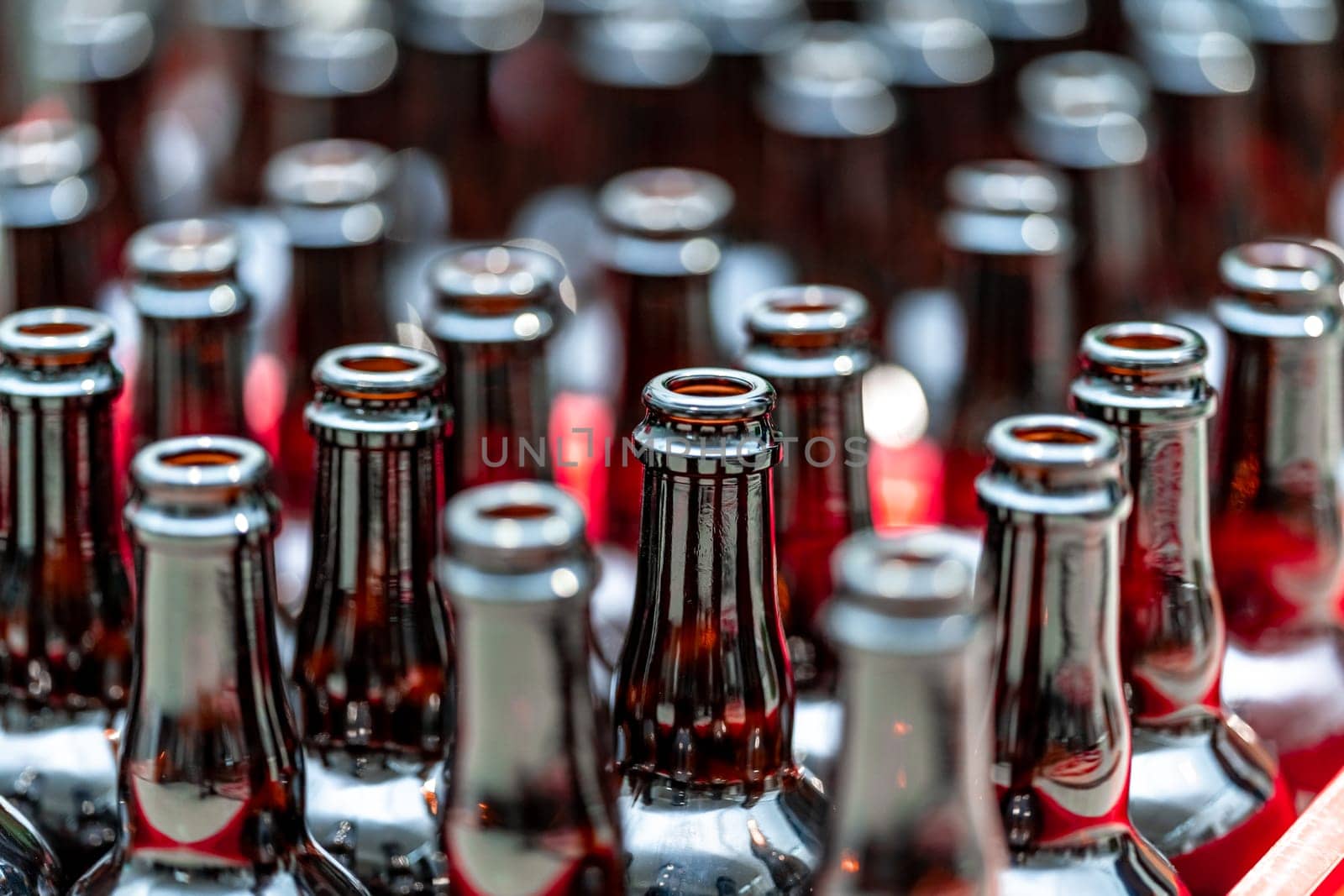 empty glass drink bottles in stock. High quality photo