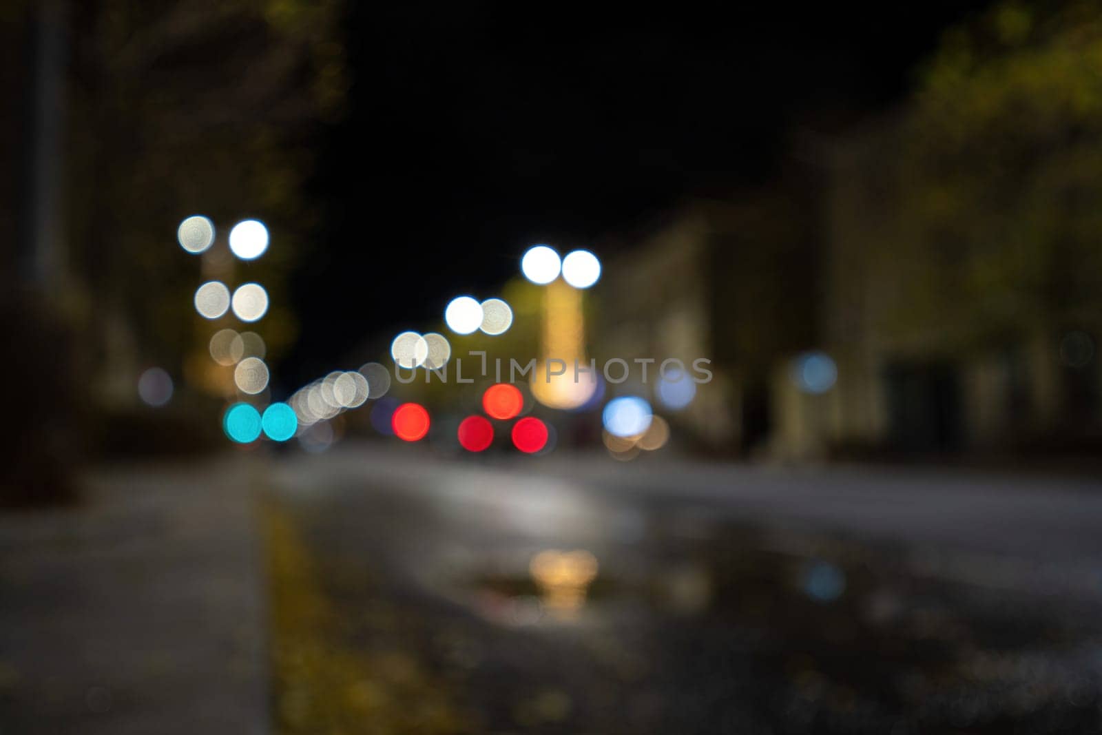 Blurred footage of transport. Blur of city lights along the road, light out of focus at night. Night city traffic, beautiful background. by Matiunina