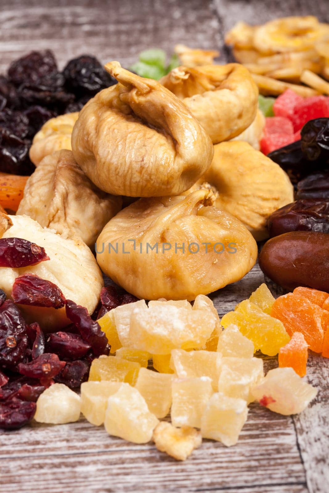 Dried healthy nuts on wooden background by DCStudio