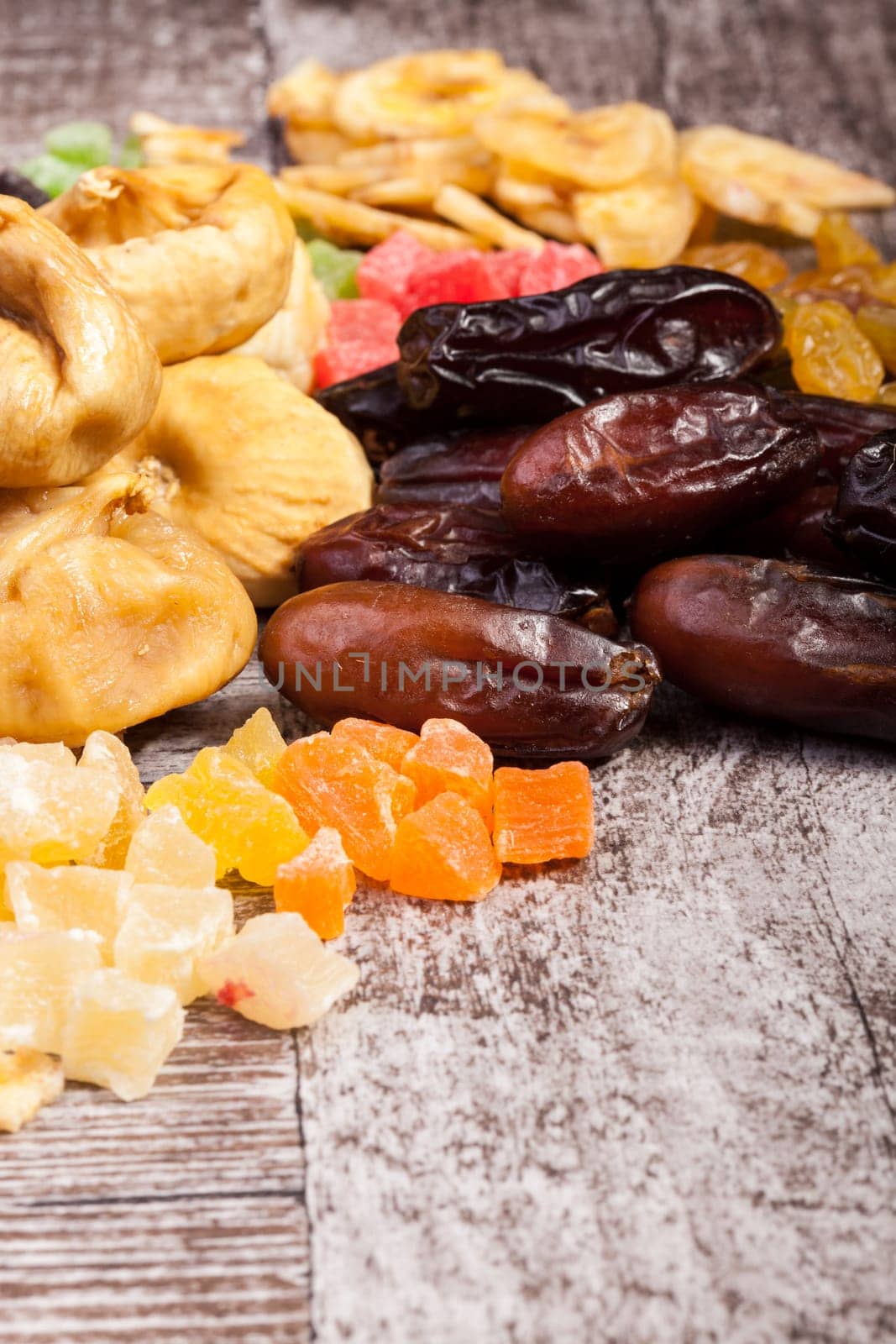 Dried fruits and nuts on wooden background by DCStudio