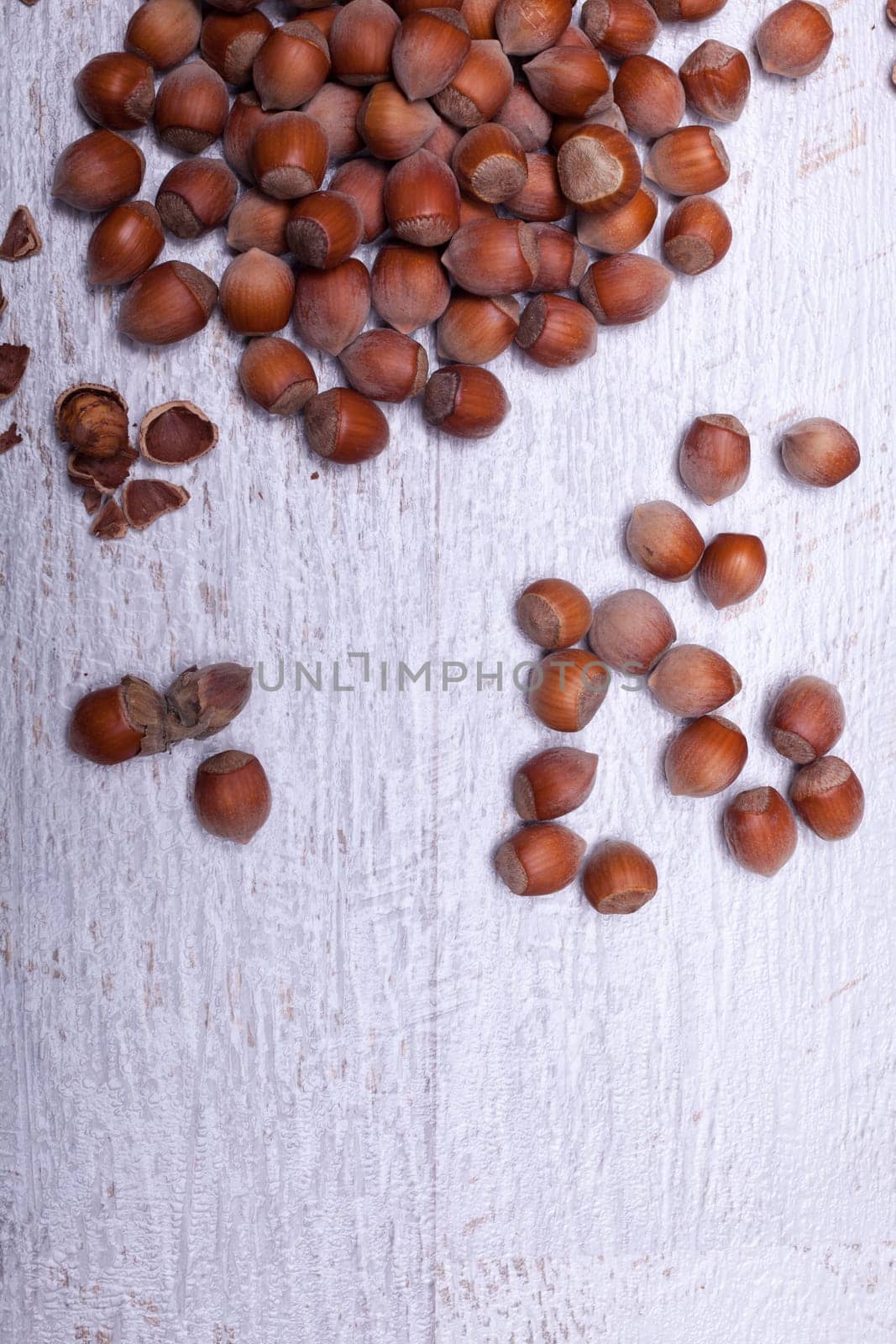 Hazelnuts on wooden background. Over top view