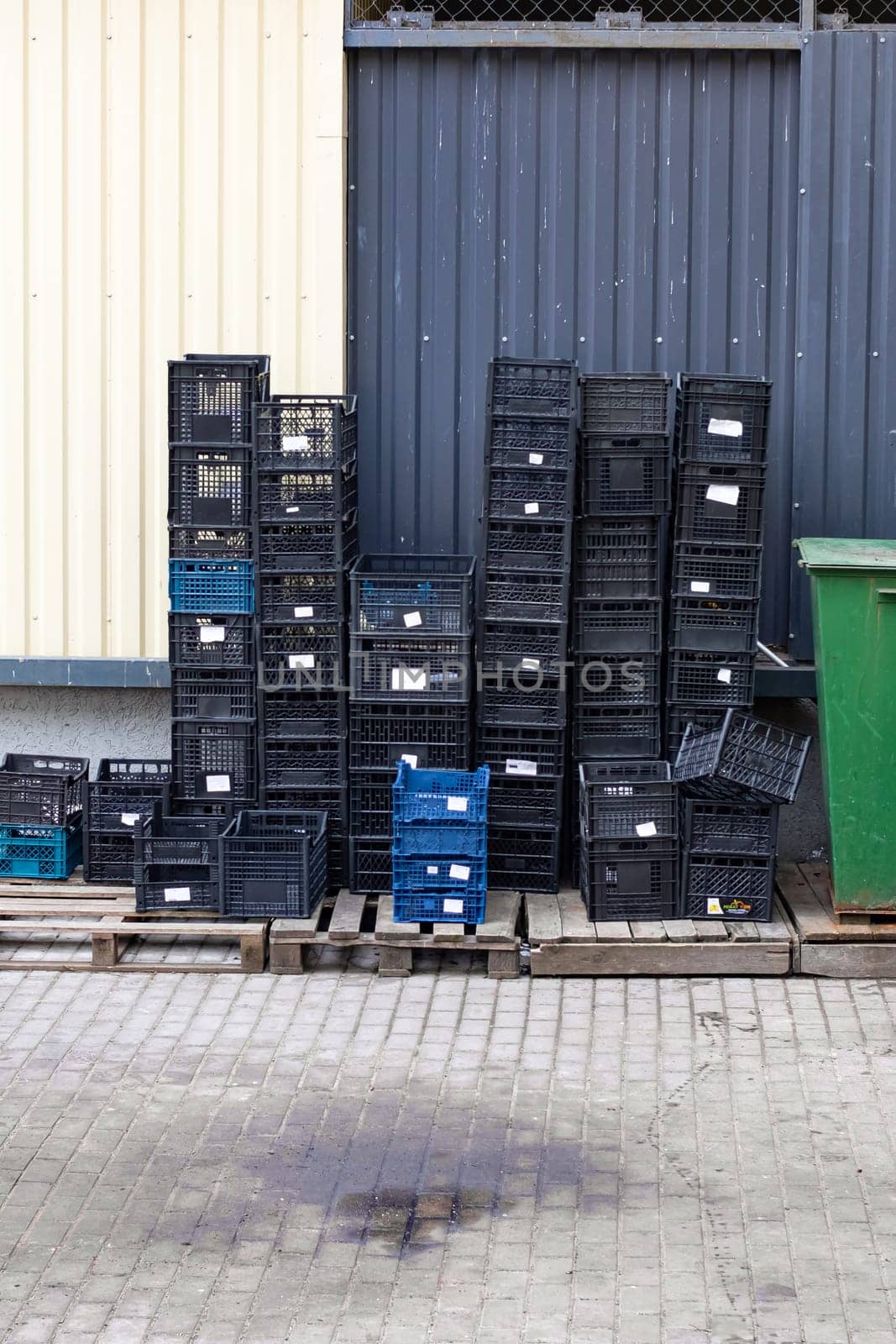 Empty plastic boxes in the courtyard of the store close up