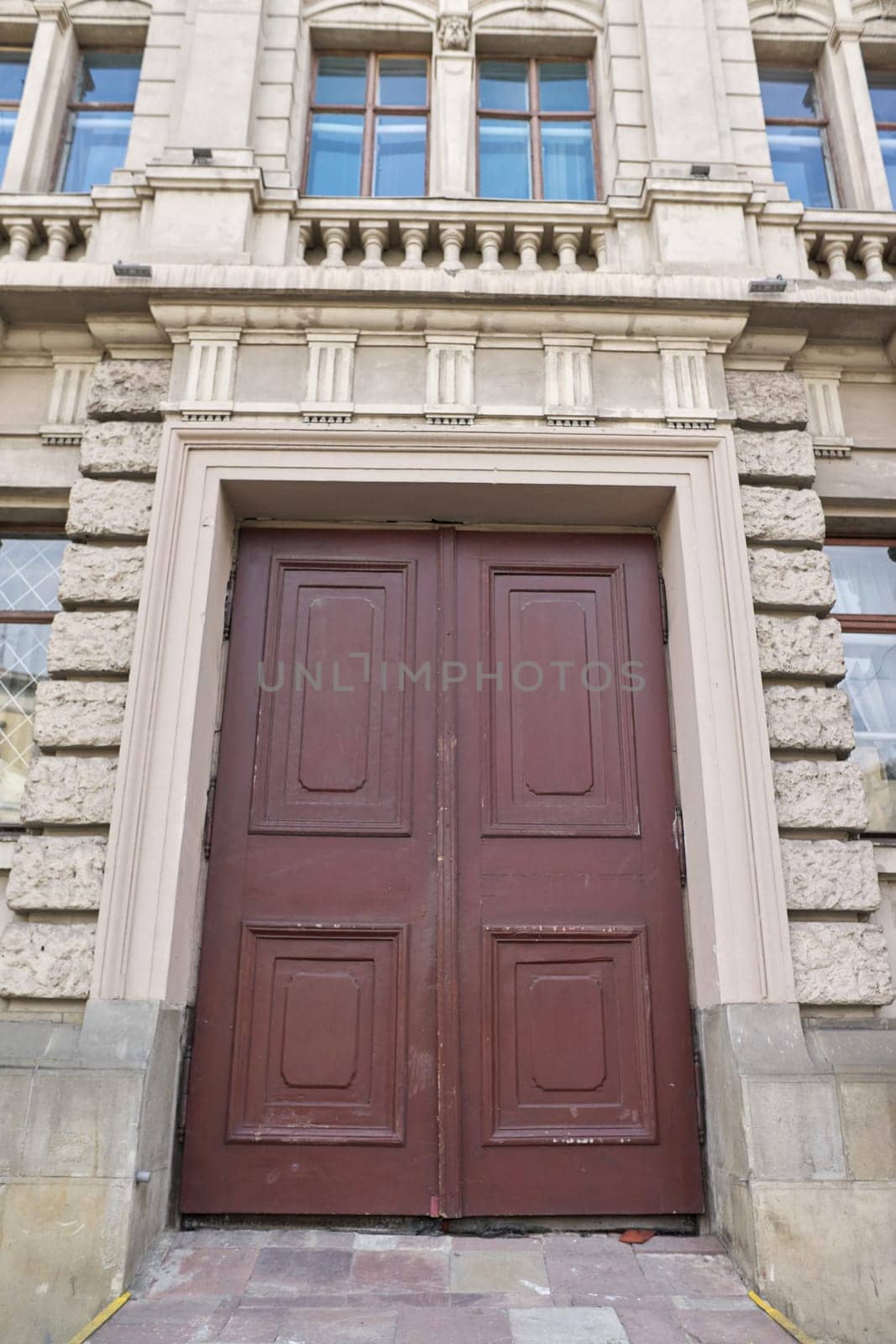 Old vintage wooden facade front brown door.