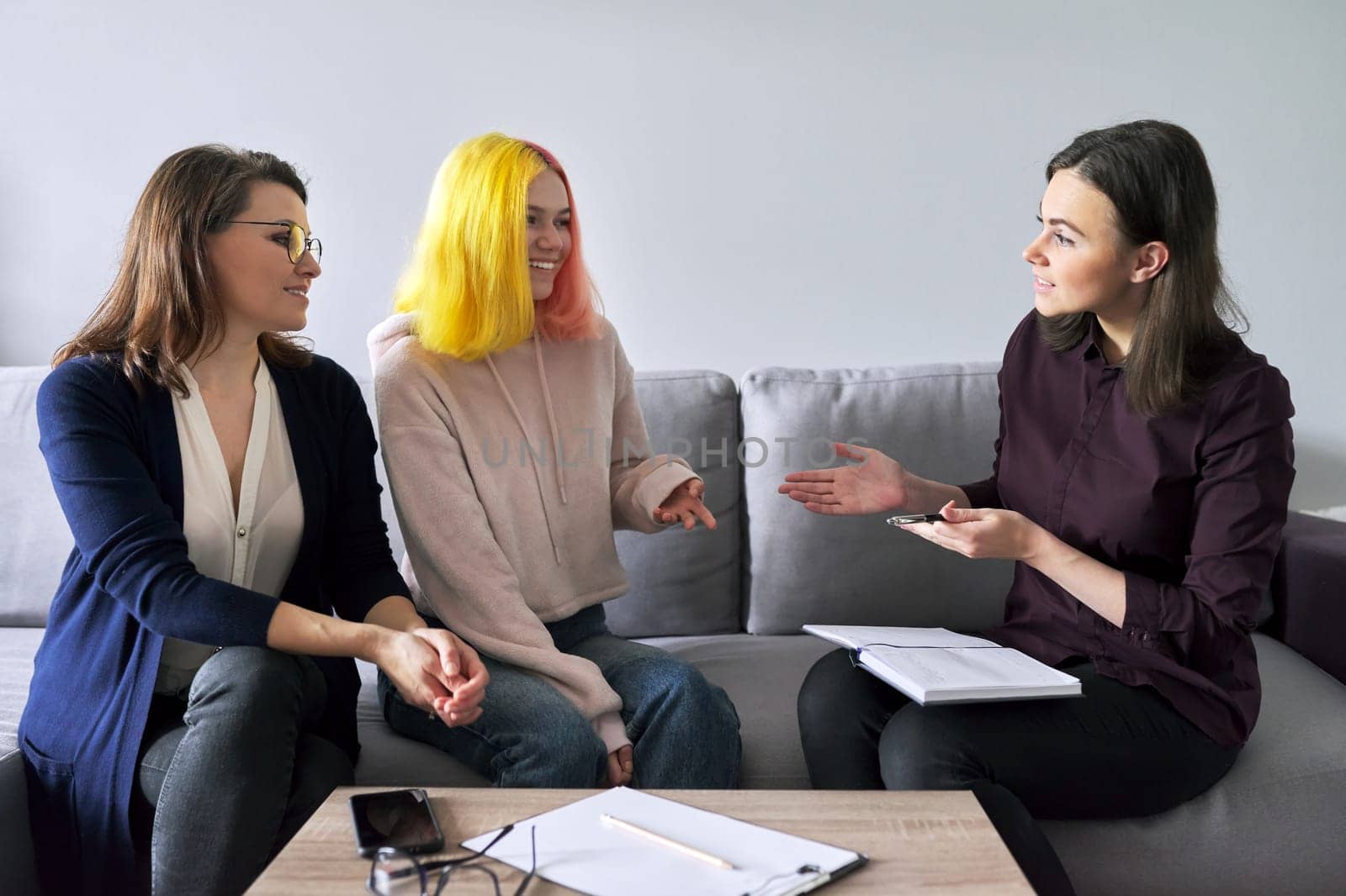 Social worker, psychologist at meeting with mature woman and her teenage daughter by VH-studio