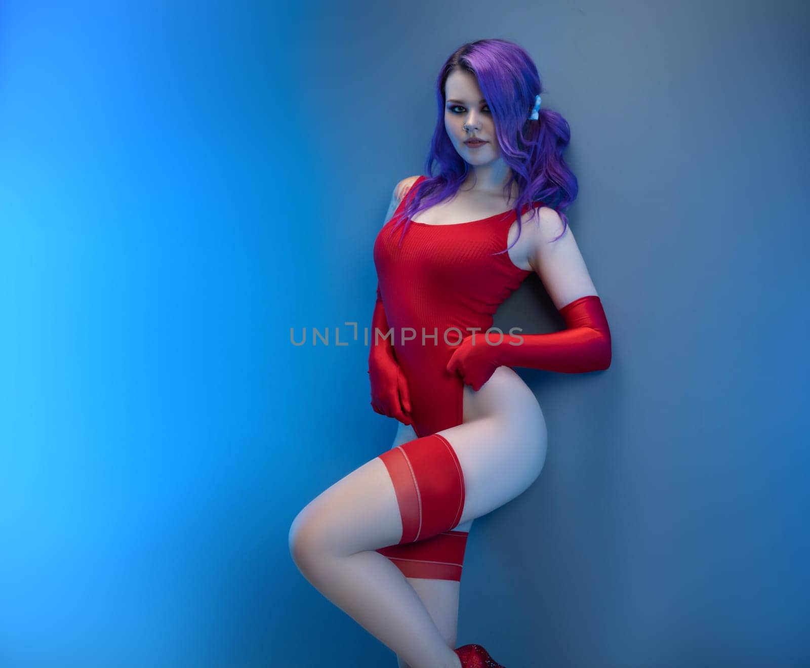 sexy girl in red bodysuit stockings and red gloves poses erotically against the background by Rotozey