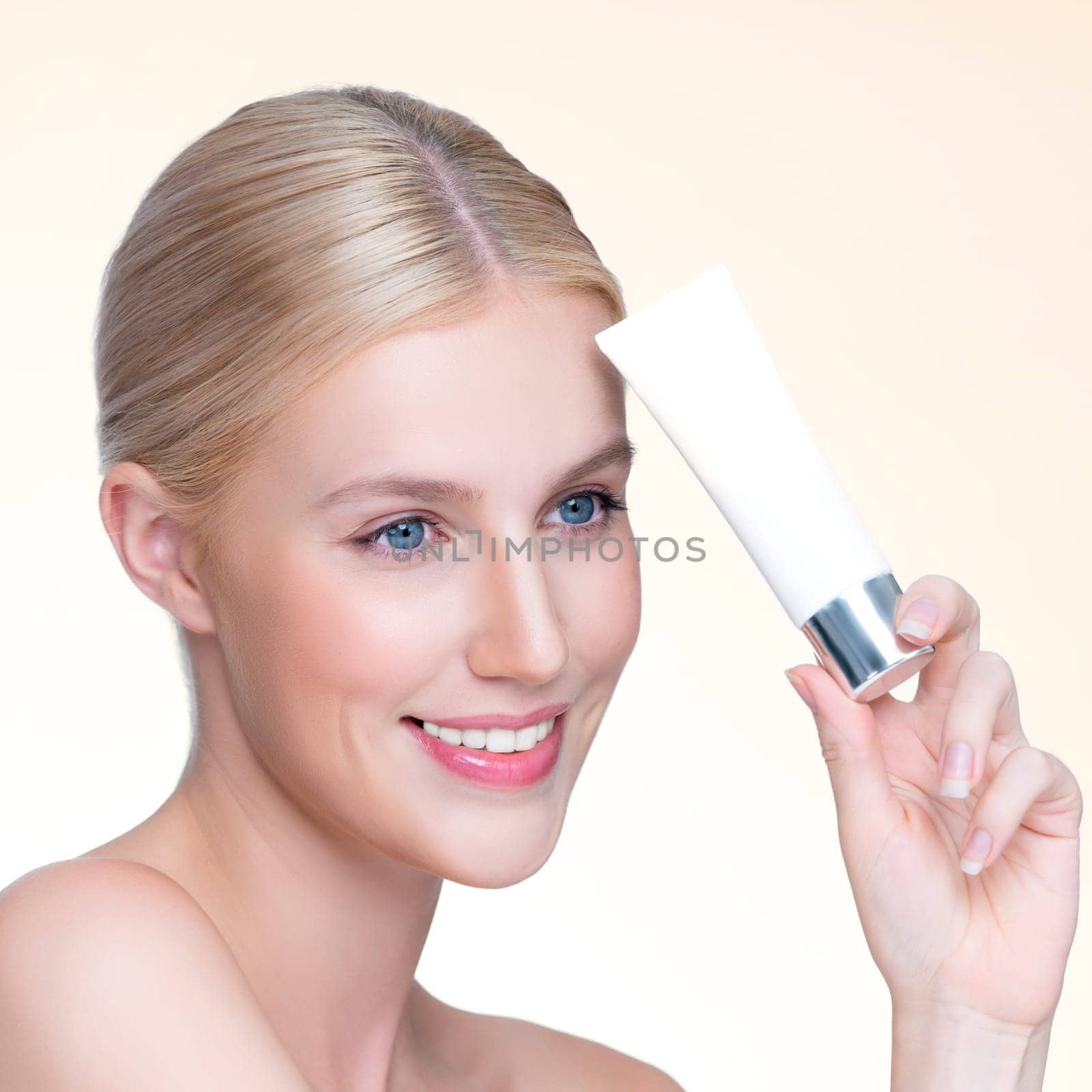 Closeup personable beautiful perfect natural skin woman hold mockup tube moisturizer cream for skincare treatment product advertising expressive facial and gesture expression in isolated background.