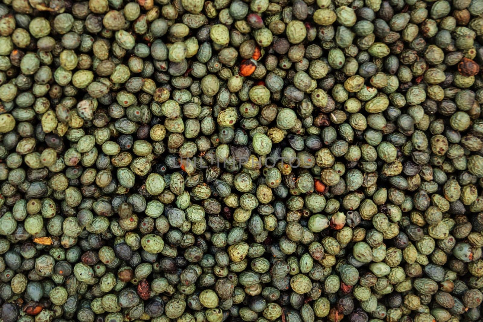 Turkish green, blue and black tellicherry pepper displayed on food market. Kyrenia, Cyprus