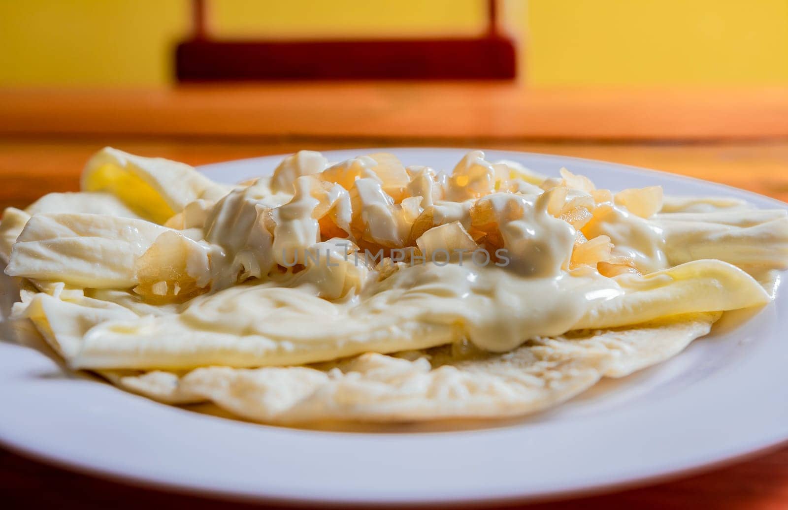 Traditional Cheese with Pickled Onion, Traditional cheese dish with pickled onion and cream. Concept of typical foods of latin america