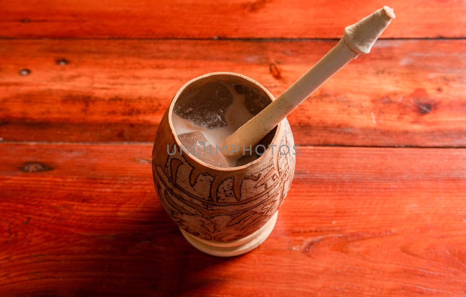 Nicaraguan cocoa drink in artisan jícara. Nicaraguan cocoa drink served in a traditional gourd. Concept of traditional drinks from Nicaragua and latin america