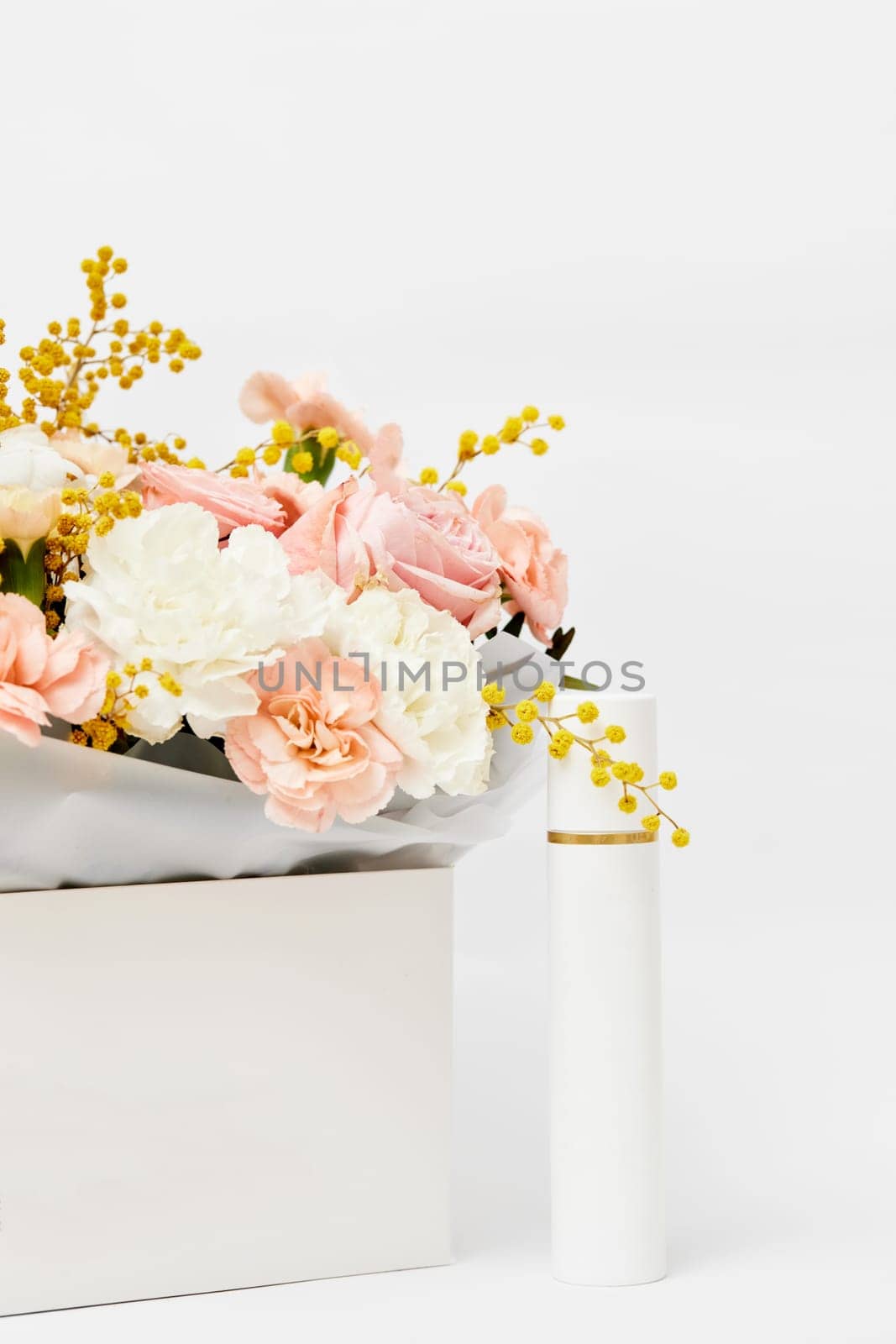 cosmetic beauty product bottle mockup with natural ingredient and spring flower. natural concept