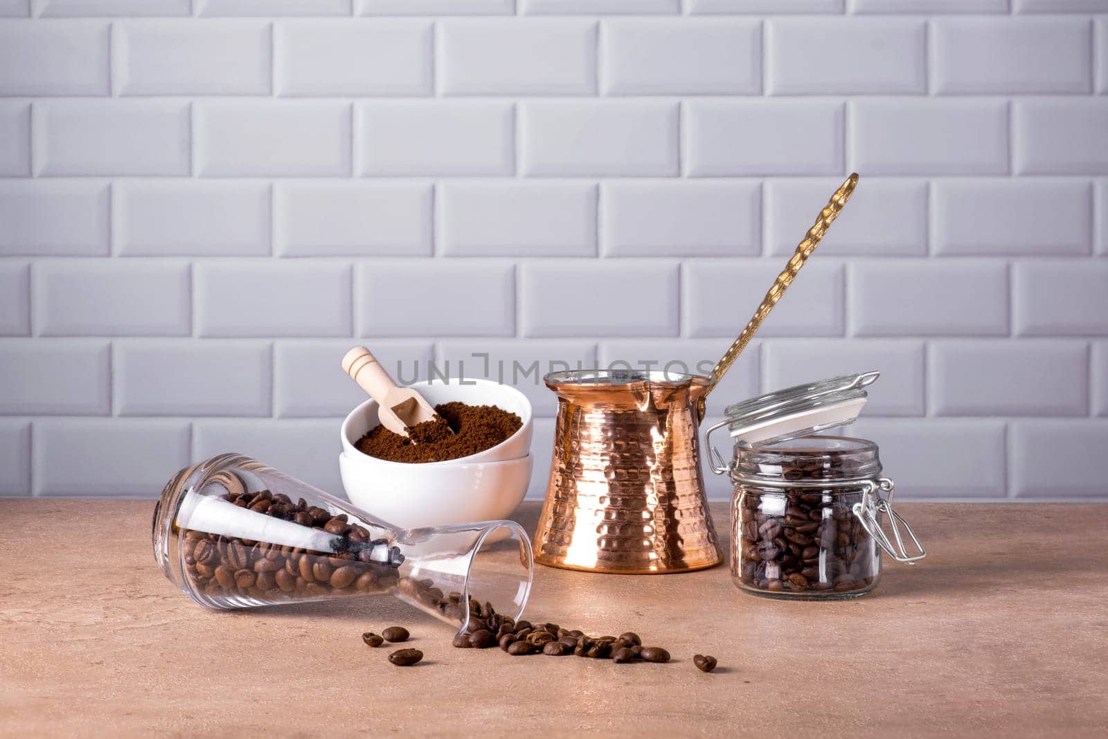 Coffee beans and ground coffee in glass and porcelain containers. Traditional Turkish cezve. Coffee break. Selective focus.
