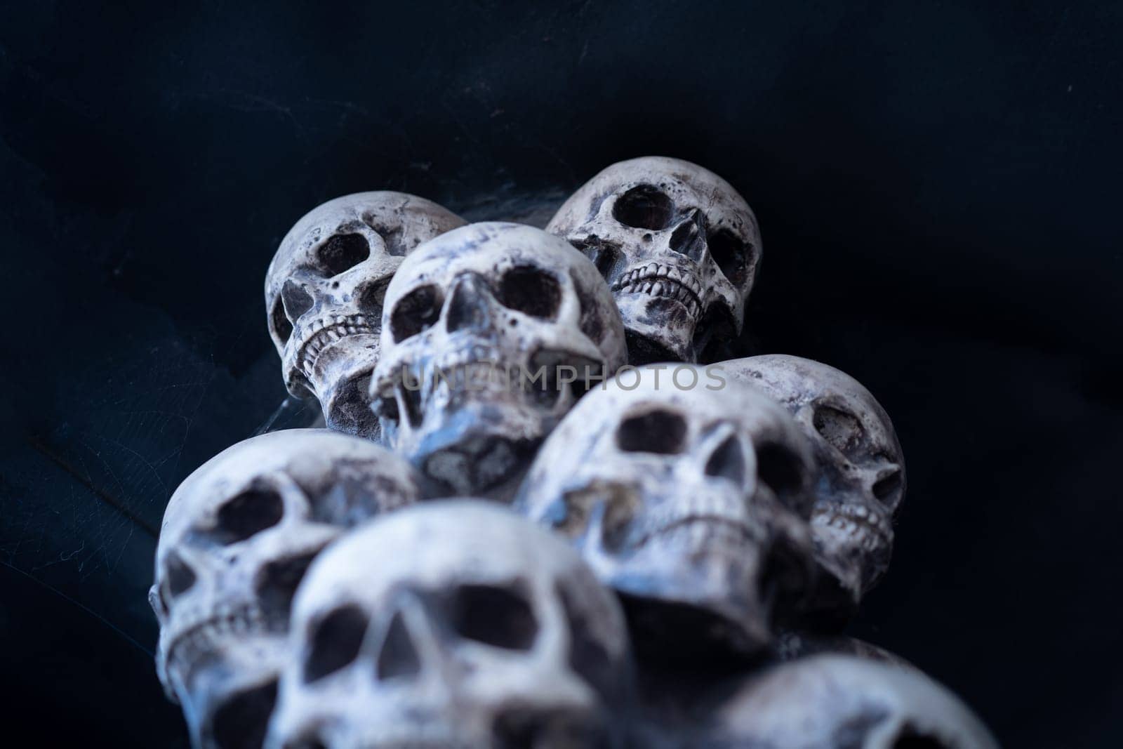 Skull Halloween Background Many People Skulls Stand on top of each other. Mystic creepy concept. Abstract nightmare occult memorial by andreonegin