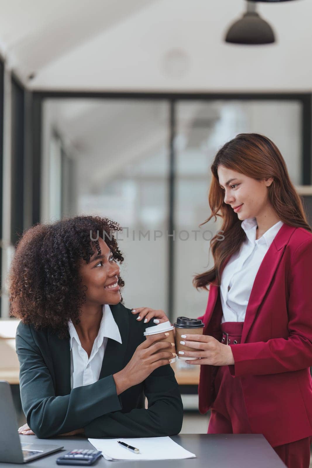 Multiethnic business people meeting and communicating at coffee break. Tax, exchange, accounting and financial advisor.