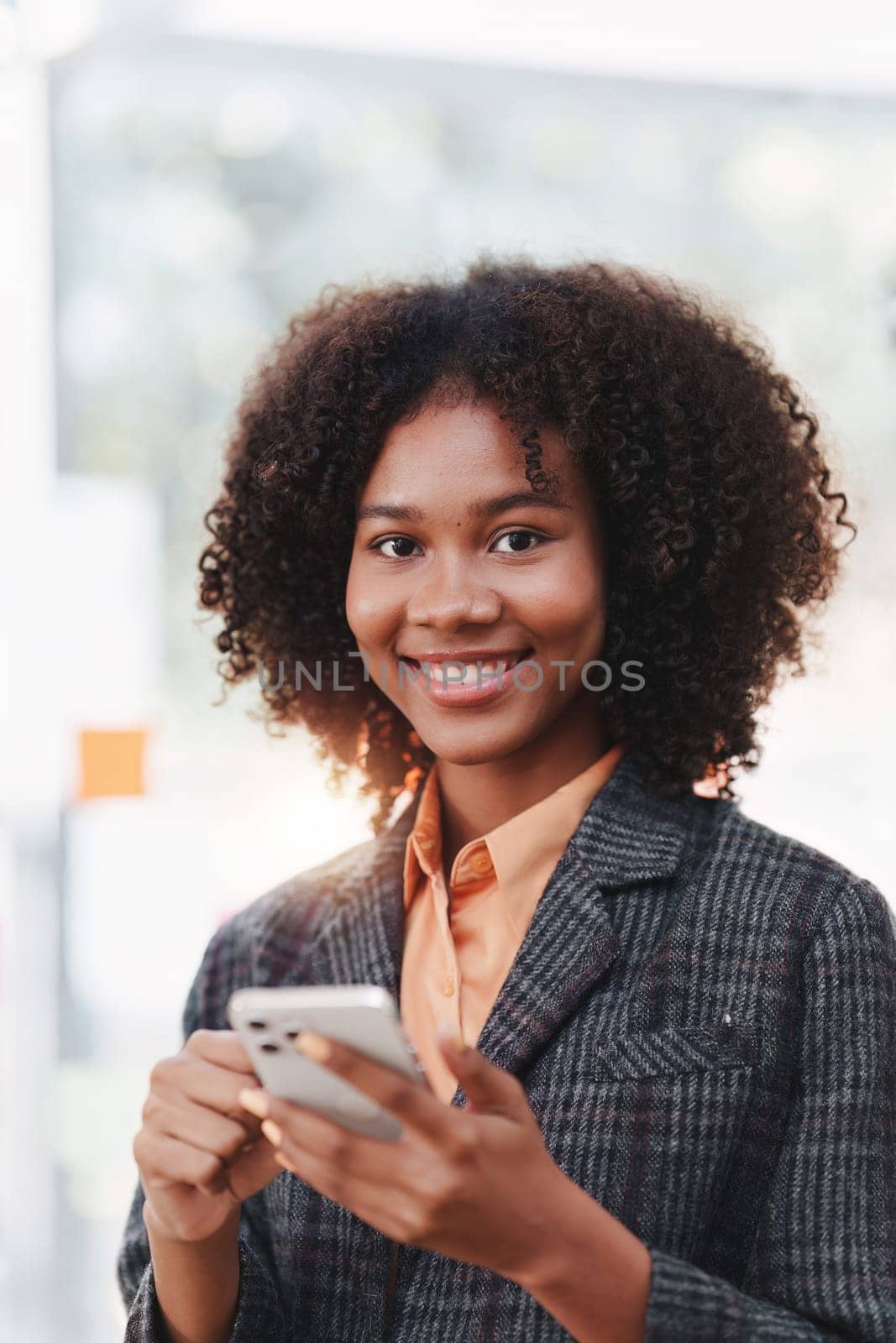 Beautiful American African woman completes KYC using an online banking program in order to open a digital savings account. The definition of cyber security.