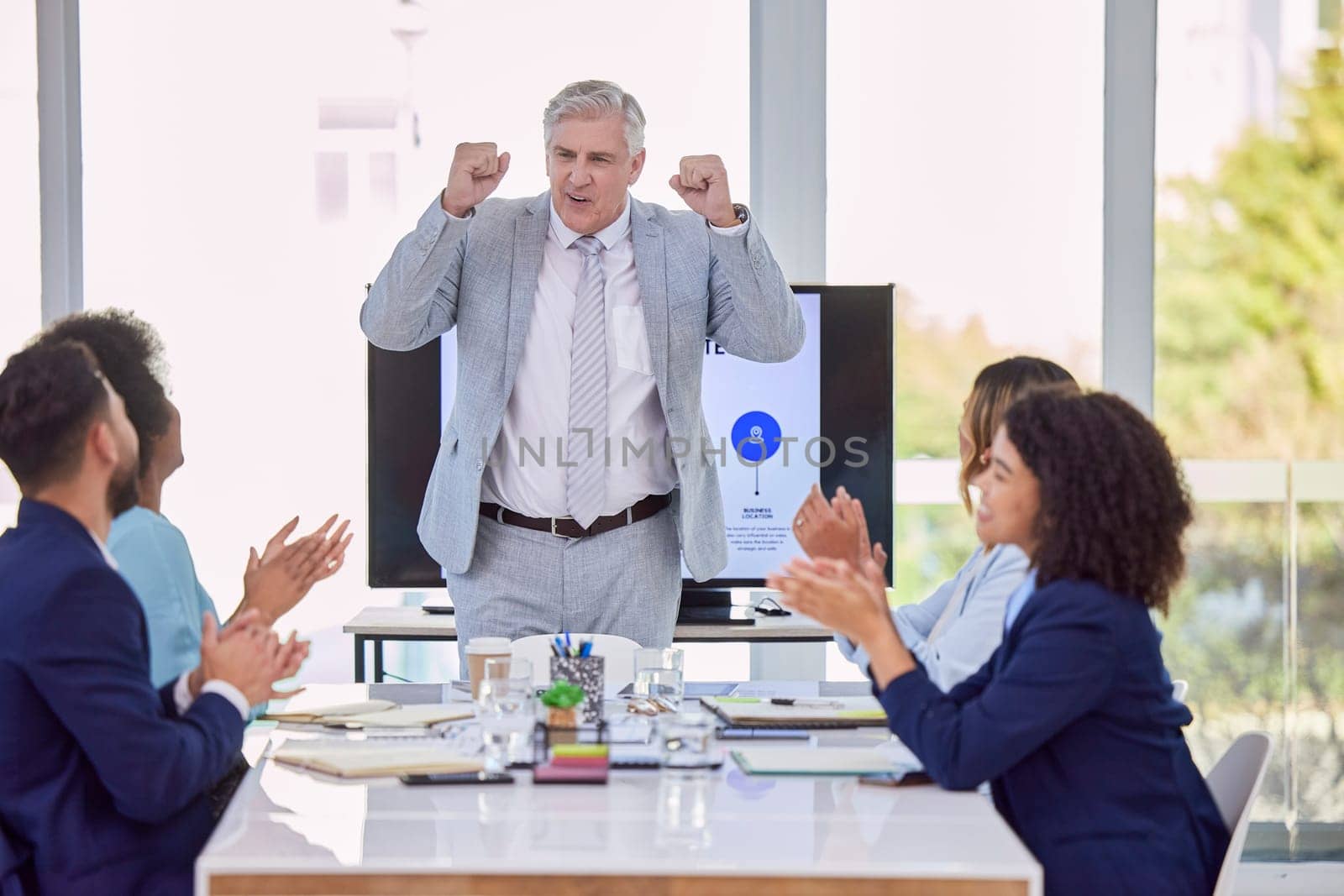 Senior businessman, presentation and meeting with applause for coaching, training staff or planning at office. Mature CEO man in leadership with employees clapping in teamwork for corporate strategy.