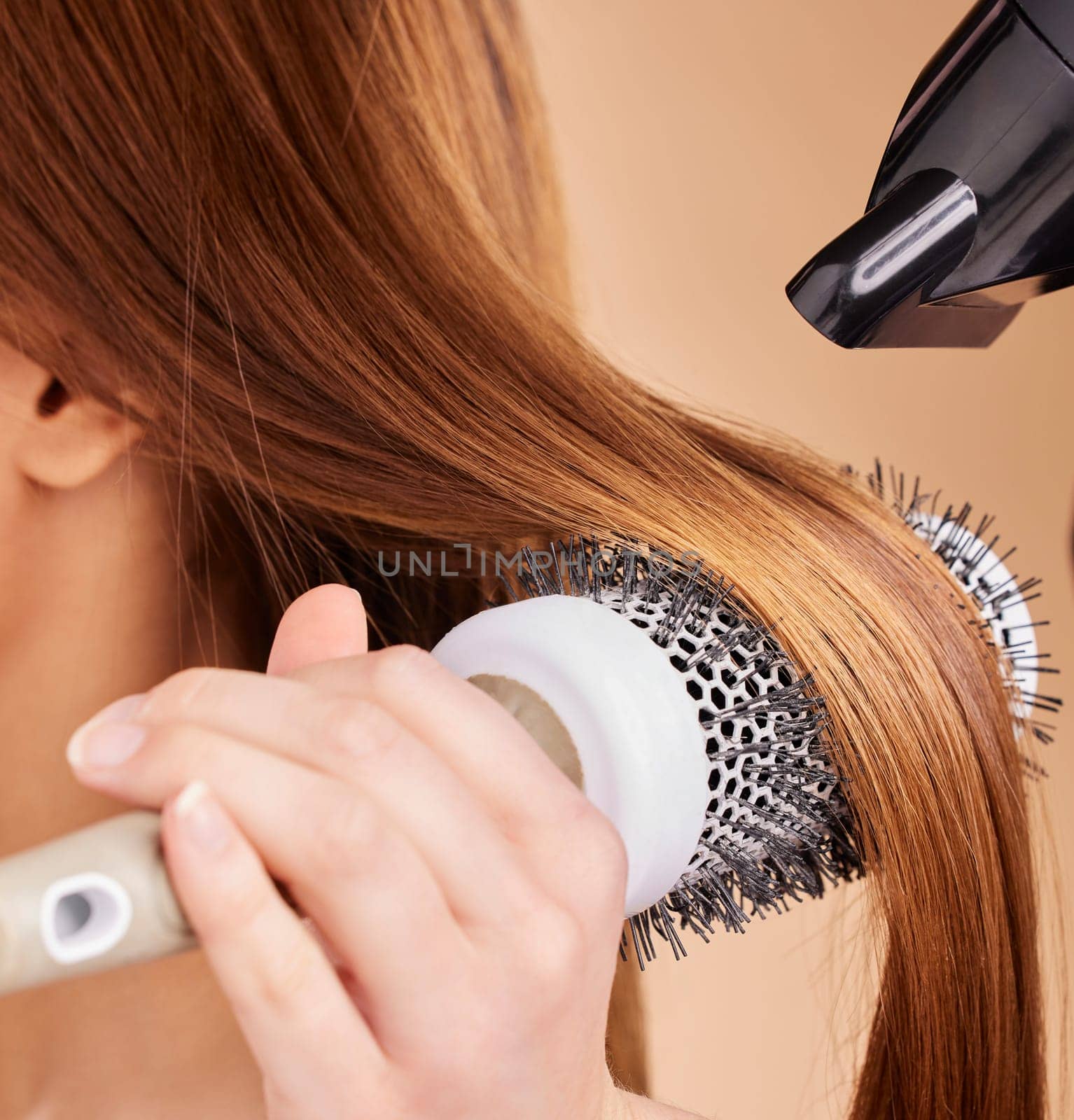 Hair, closeup and woman with hairdryer in studio for beauty, blowing and styling on brown background. Zoom, haircare and girl with salon treatment, hairstyle and hairdressing appliance isolated by YuriArcurs