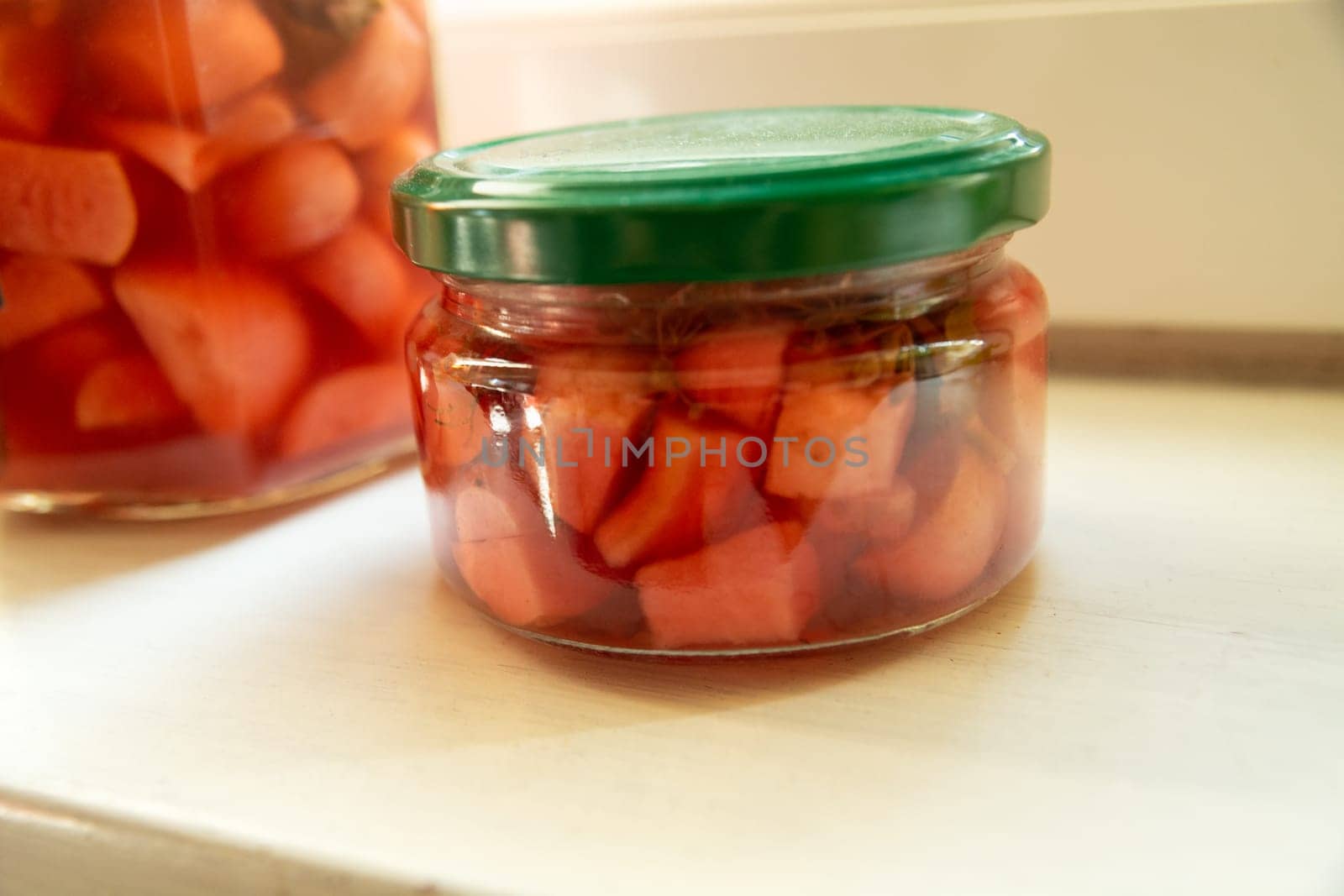 Pickled garlic in a small jar, winter stock by darekb22