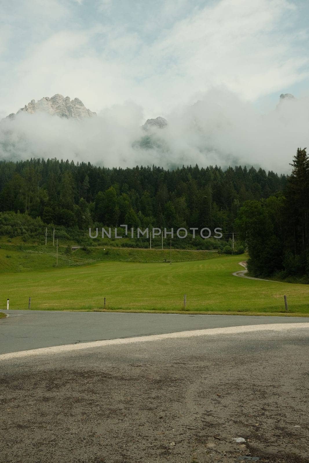 View of Leoganger Steinberge with mountain peaks in clouds in Austria