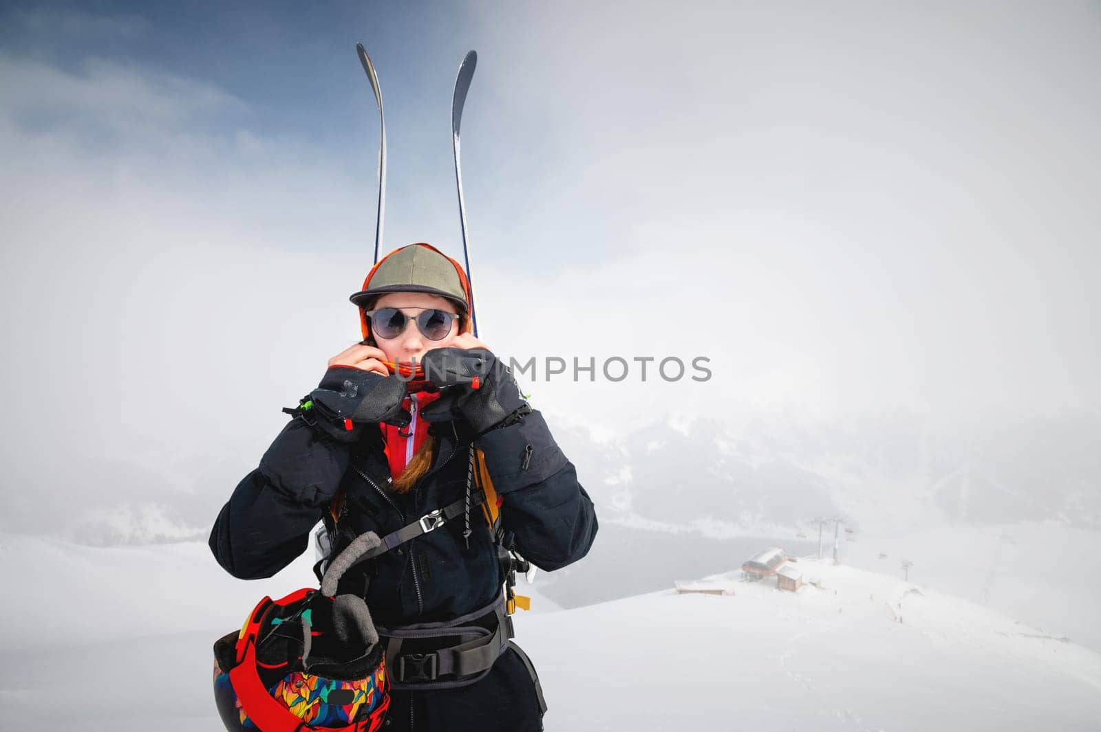 Mountaineer backcountry skiing skiing woman climber in the mountains. Ski tourism in the alpine landscape. Adventure winter sport. Freeride on skis by yanik88
