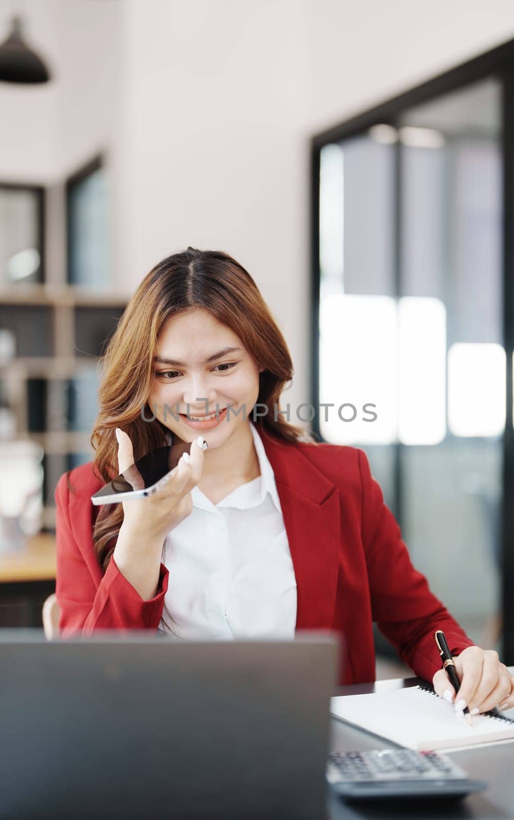 Beautiful young teen asian businesswoman using computer and smartphone mobile with planning working on financial document, tax, exchange, accounting and Financial advisor.