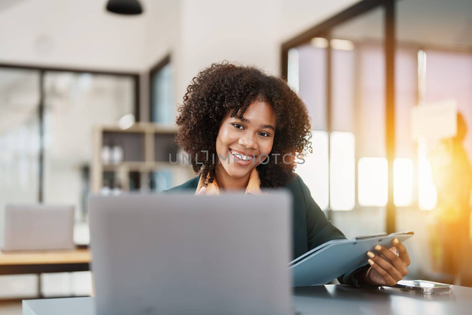 Beautiful young teen American African business women holding computer laptop with hands up in winner is gesture, Happy to be successful celebrating achievement success by Manastrong