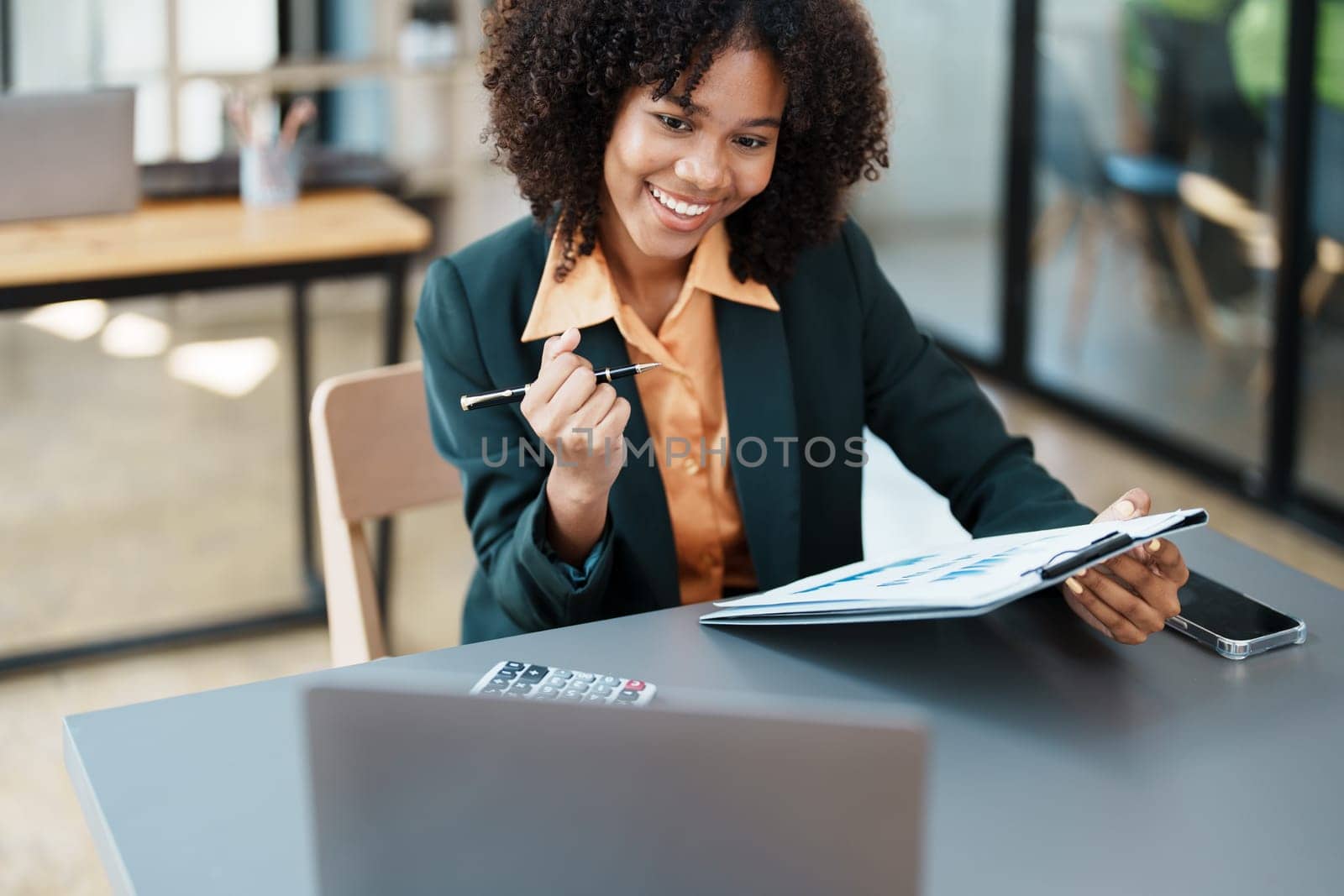 Beautiful young teen American African business women holding computer laptop with hands up in winner is gesture, Happy to be successful celebrating achievement success by Manastrong